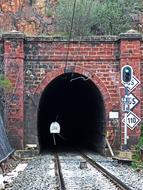 dark tunnel with railroad