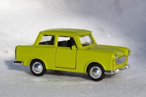 model of a yellow car on a white background