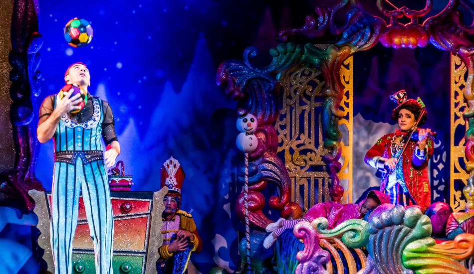 Juggler among the colorful decorations in the theater