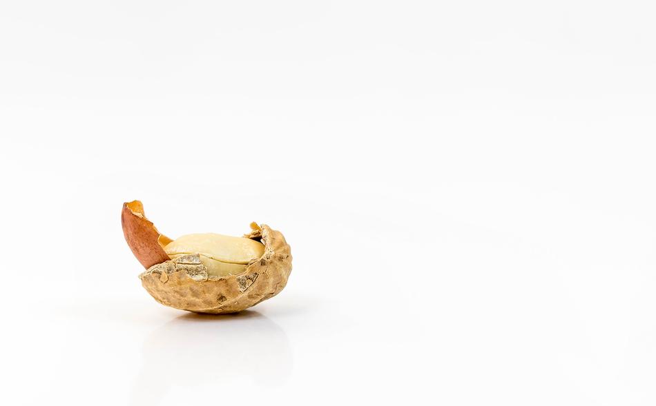 ripe delicious peanuts on a white background