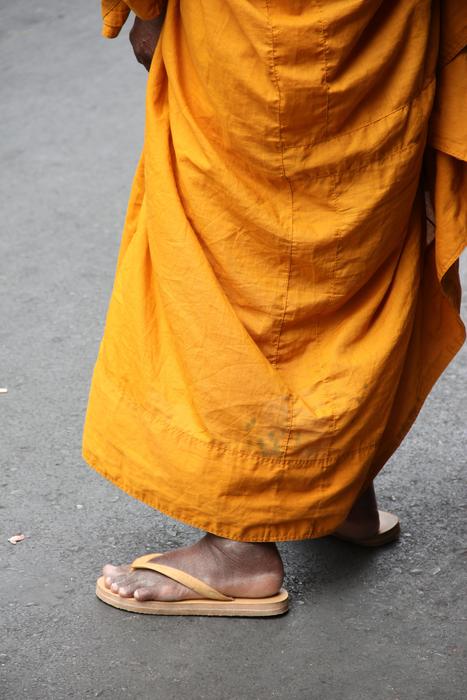 Buddhist clothing and legs in Bangkok, Thailand