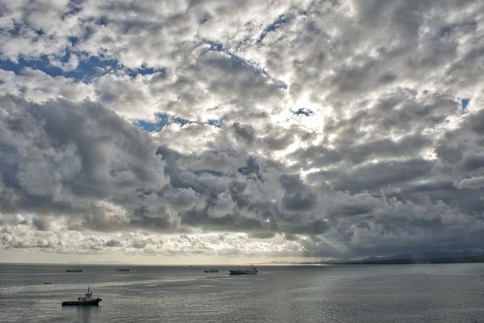 sea view with ships and clouds