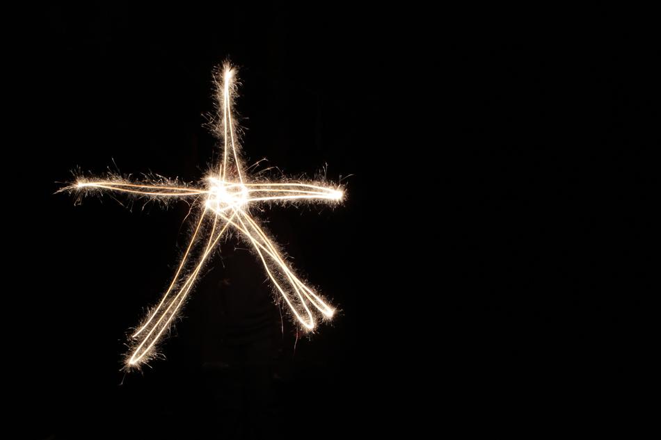 bright lines of light in the black sky
