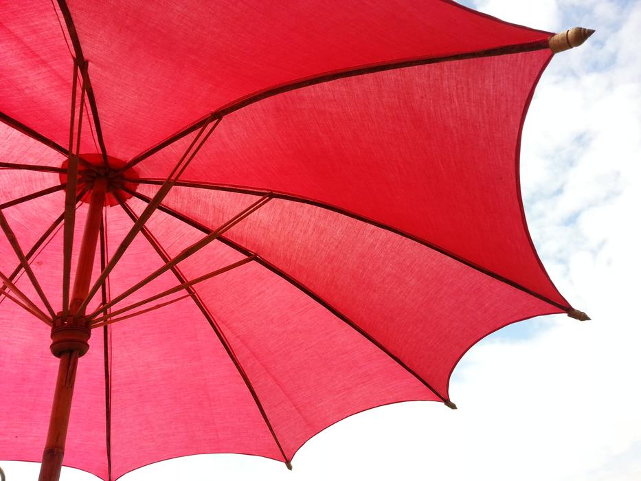open red umbrella against the sky