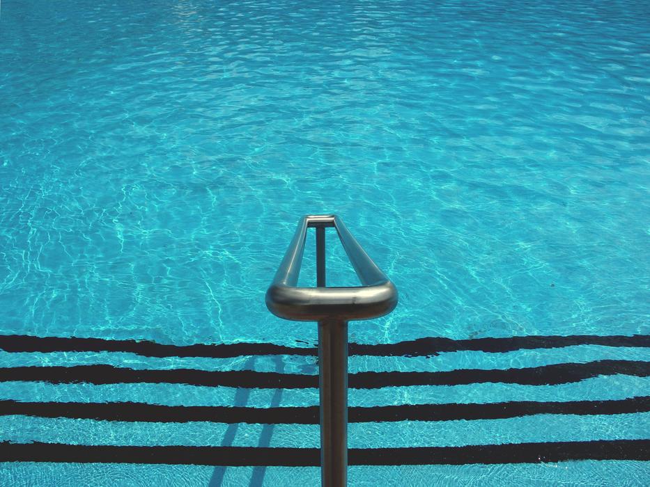 iron railings at the stairs leading to the pool