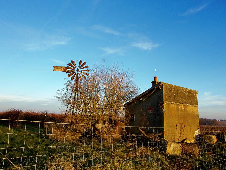 old windmill in a field