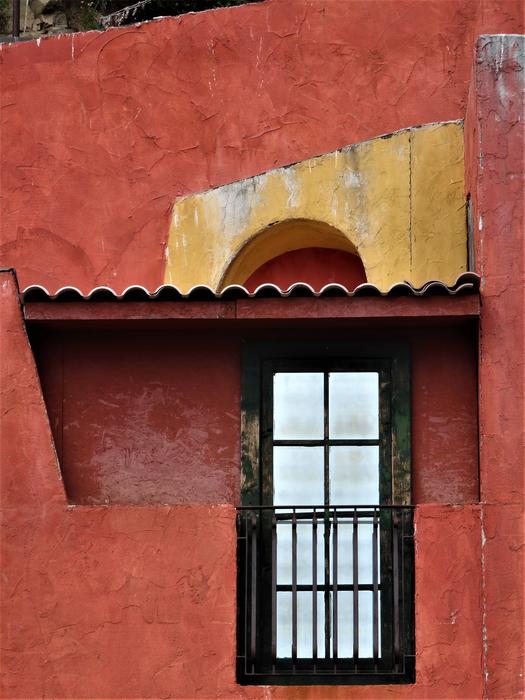 Window of the beautiful, red and yellow building