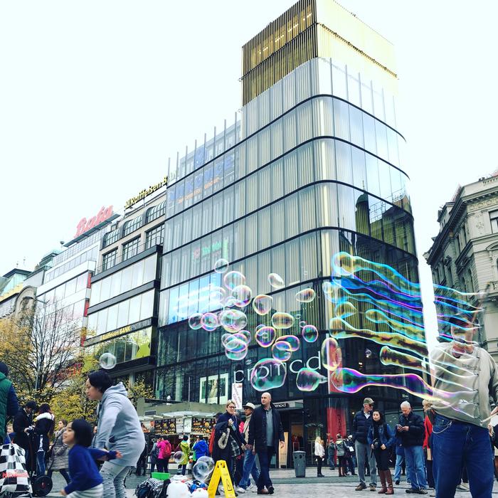 a big glass building with people