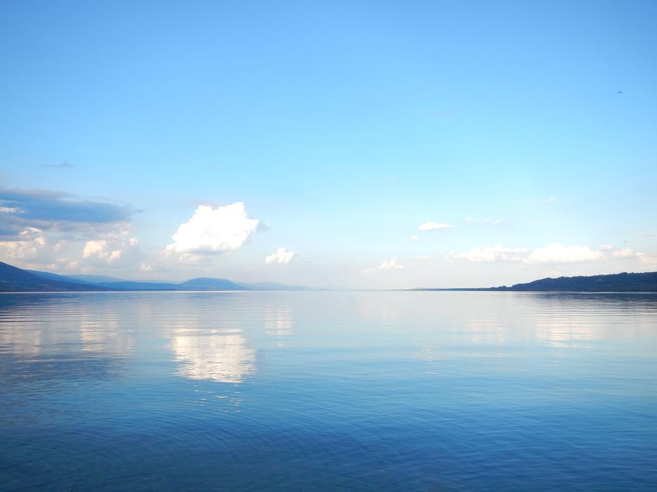 photo of a quiet blue lake