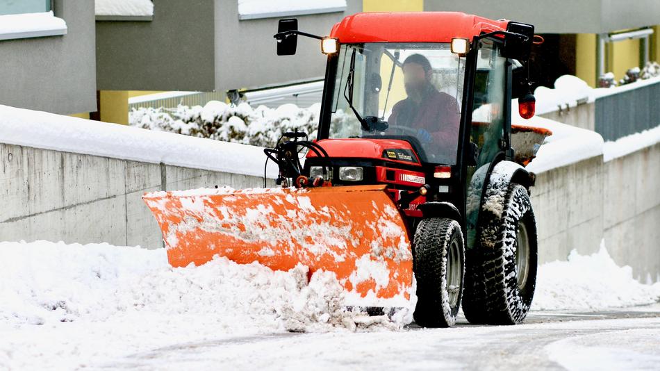 snowplow vehicle with person