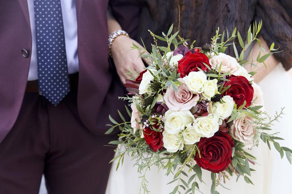 Wedding couple with a bouquet of flowers