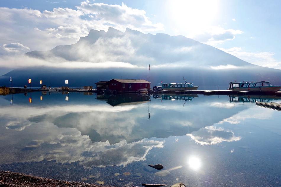 reflection of the sun with the sky in the lake