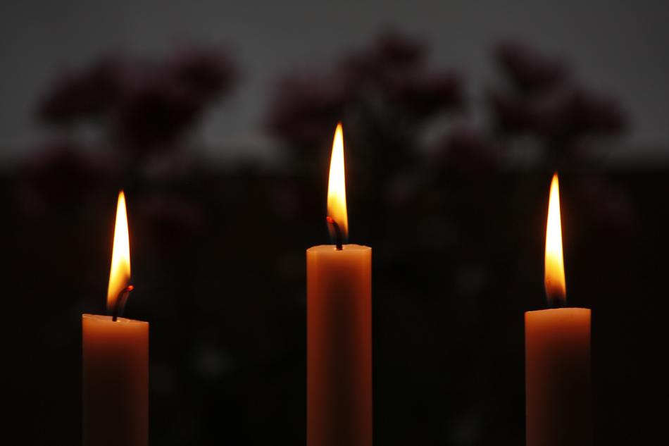 burning wax candles in the dark