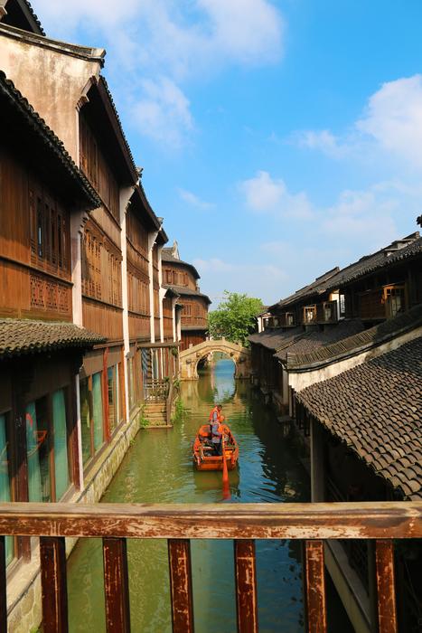 Beautiful and colorful small town, with the green water, on the view from the bridge