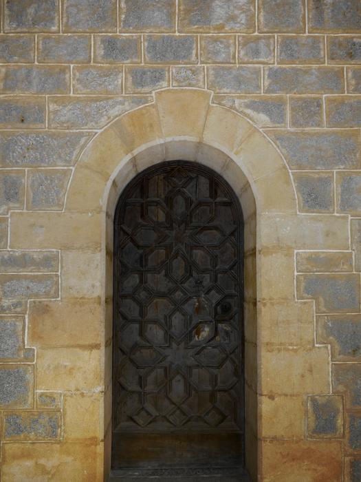 wooden doors with patterns to the church
