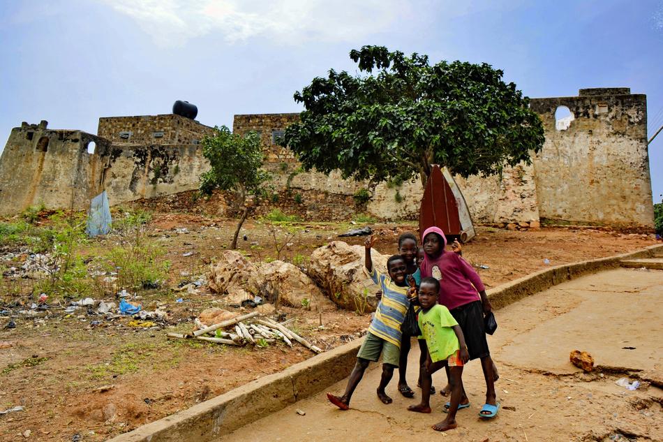 children in africa by the house