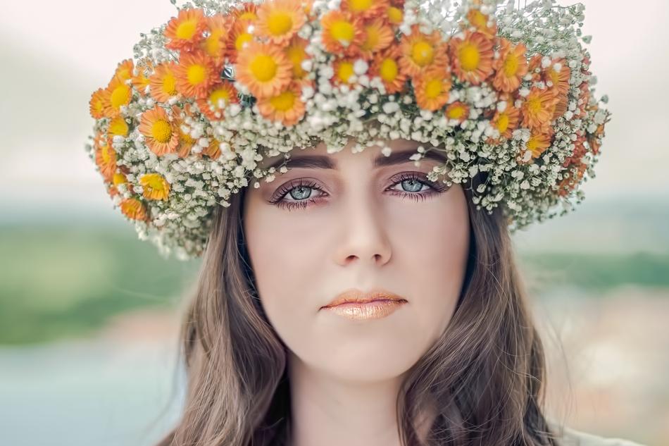 beautiful girl with a wreath on her head