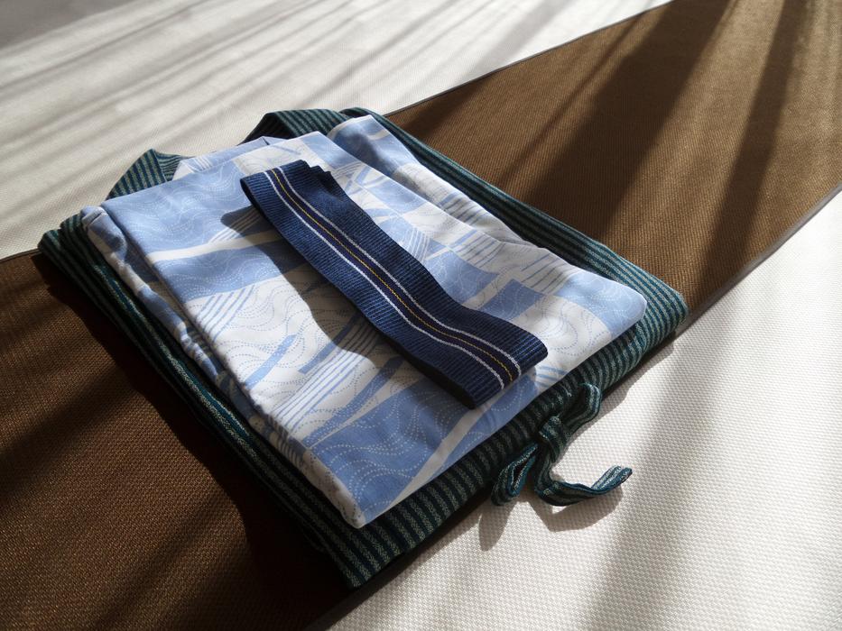 cozy clothes on the bed in the hotel
