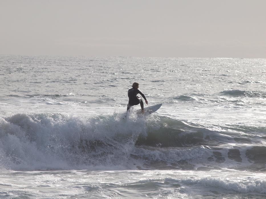 Surfer conquers a wave