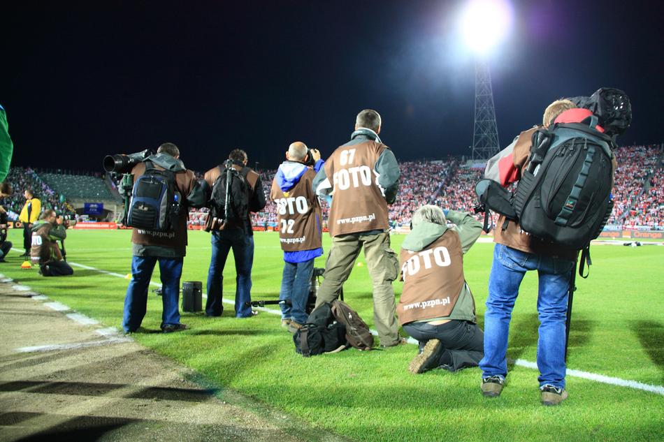 photojournalists on the edge of a soccer field