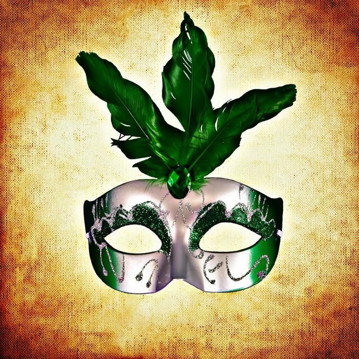green carnival mask with decorations