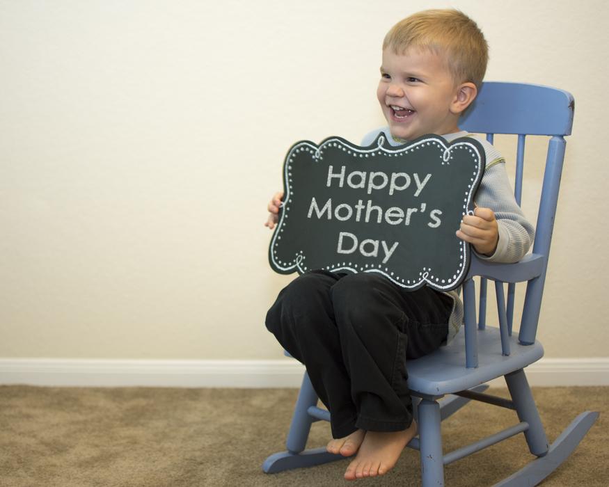 happy baby in a chair