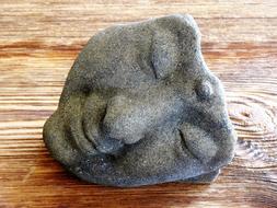 stone face of the statue