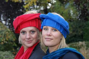 Girls in red and blue hats