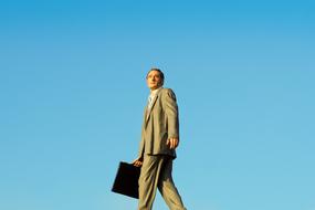 businessman figure at blue background, germany, dusseldorf