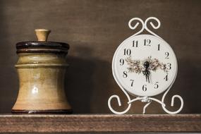 Hour and Ceramic decoration on the wood