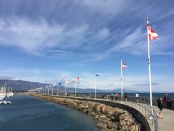 flags by the road against the sky