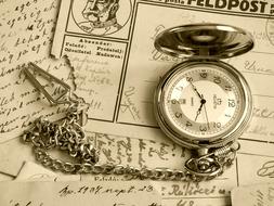 old pocket watch on paper