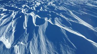 wind traces on blue snow