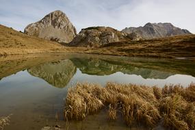 reflection of mountains and clouds in the lake