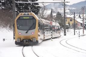 modern train departing in winter