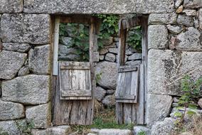 wooden old door in a stone fence