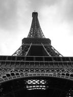 bottom view of the eiffel tower in black and white