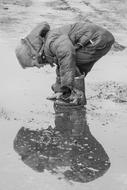 boy in a puddle in monochrome