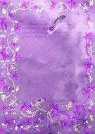 Writing text with the feather on the beautiful violet and pink scrapbooking paper with floral frame