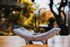 scented candle on a stone base