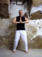 man teaches yoga