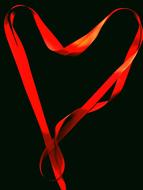 red ribbon on a black background