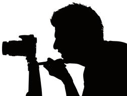 man taking photo with camera on tripod, silhouette