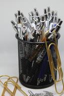 lot of office pens in a glass