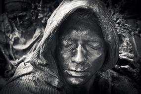 black and white photo of a monk's sculpture head in Dusseldorf