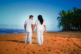 cute couple on the sand by the sea