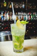 refreshing drink with lime at the bar