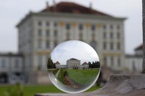 mirrored circle with a view of the building