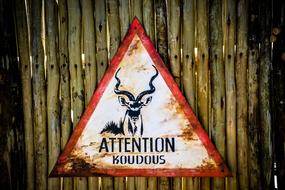 attention animal sign on fence