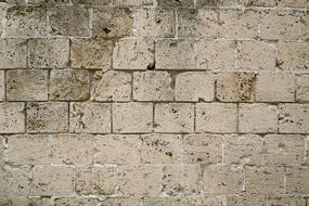 Close-up of the old, colorful stone wall texture